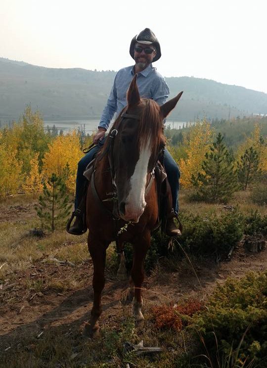 man on horse smiling